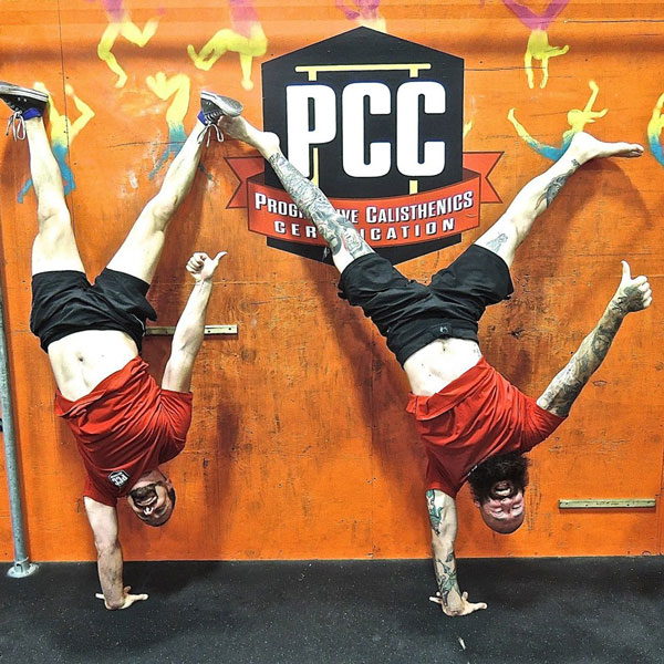 Brad and Al One-Arm Handstands