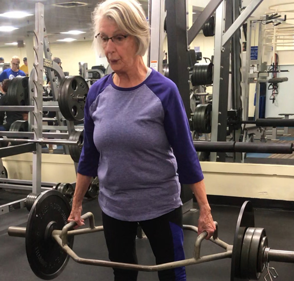 Mary's 78-year-old-client performing 100lb deadlifts for reps!