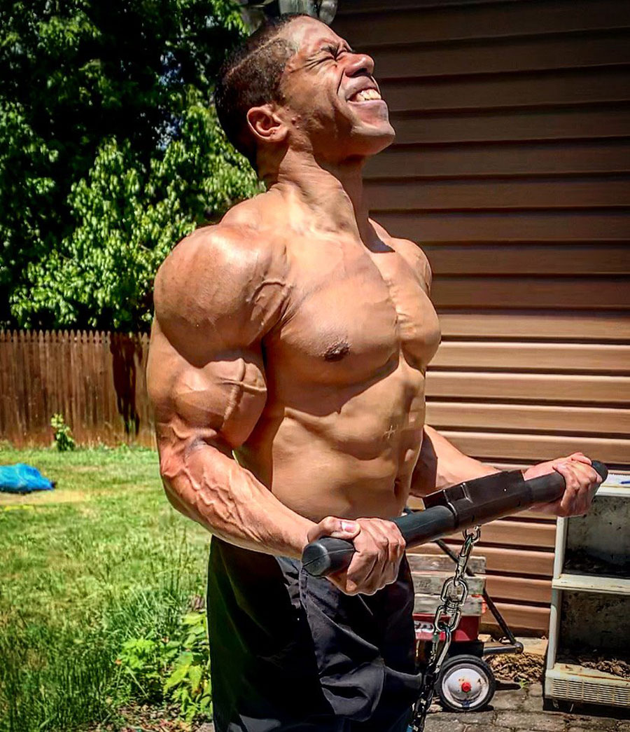 Chrys Johnson performs an Isochain Biceps Curl